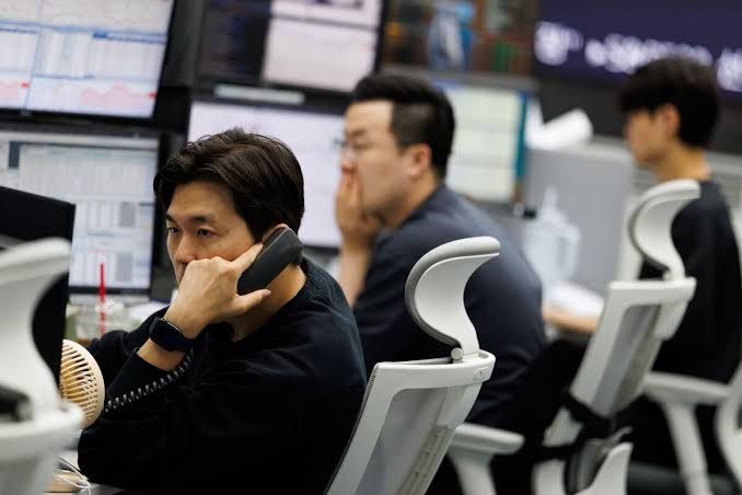 South Korean President Yoon Suk Yeol addressing officials during a briefing regarding recent stock market fluctuations.