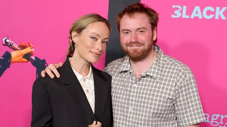 Olivia Wilde and Cooper Hoffman pose together at the premiere of I Want Your Sex at the DGA Theater Complex.