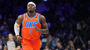 Luguentz Dort defending on the court during an Oklahoma City Thunder game.