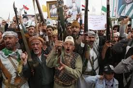 Yemeni protesters shout slogans and brandish weapons during a demonstration against the Saudi-led blockade in Sana'a.