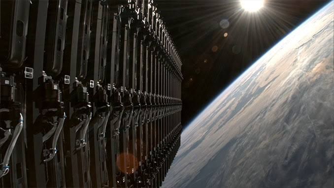 A stack of Starlink satellites prepared for deployment from a Falcon 9 rocket upper stage.