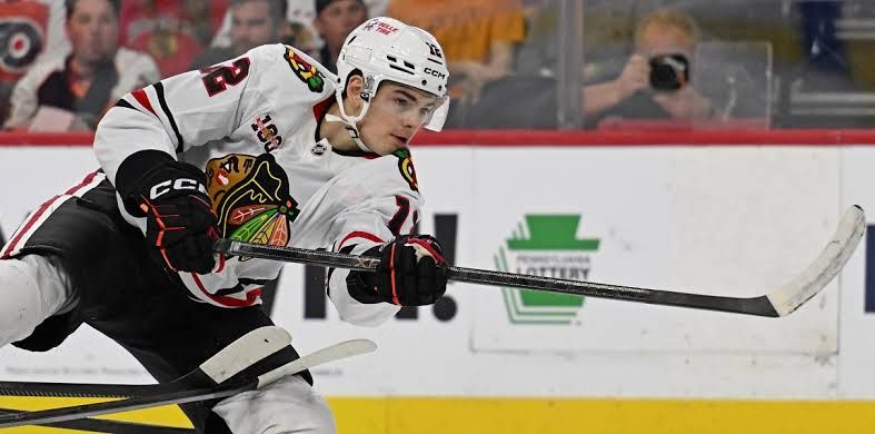 Blackhawks forward Sacha Boisvert skates during an NHL game.