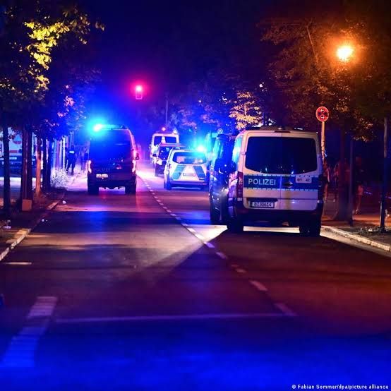 Police officers and emergency responders at the site of a vehicle incident at Berlin's Tiergarten park.