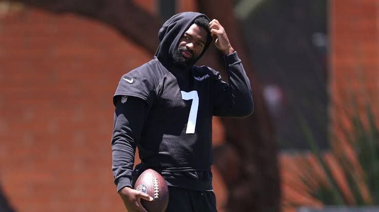Jacoby Brissett participating in football drills during Arizona Cardinals training camp in Glendale.