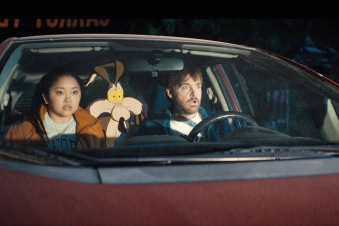 Cast members Lana Condor and Will Forte pose with Wile E. Coyote during the production of the film Coyote vs. Acme.
