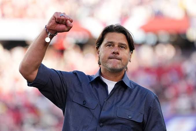 U.S. Soccer coach Mauricio Pochettino standing on the sidelines during a 2026 World Cup match.