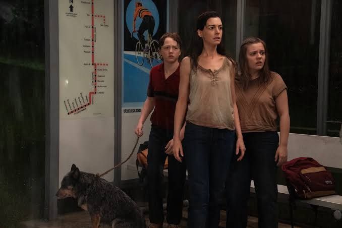 Christian Convery, Anne Hathaway, and Maisy Stella in a scene from the Warner Bros. film The End of Oak Street.