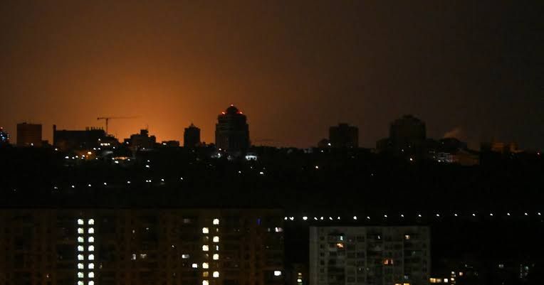 Smoke rises from damaged residential buildings in Kyiv following a Russian ballistic missile attack.