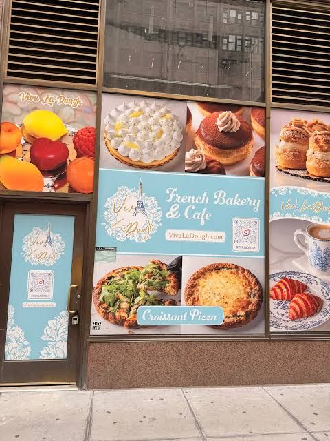 Viva La Dough cafe storefront interior with a display case of various pastries and croissant pizzas in Midtown Manhattan.