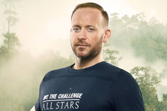 Tyler Duckworth from The Challenge All Stars Season 3 smiling during a television production.