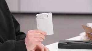 Dummy unit of the folding iPhone Ultra compared to standard smartphone designs.