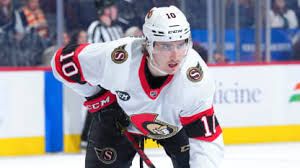 Forward Alex Formenton skating on the ice while wearing a Senators jersey during an NHL game.