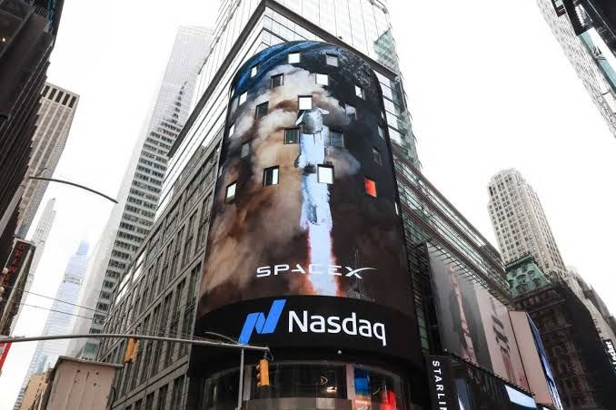 SpaceX executives ringing the opening bell at the Nasdaq MarketSite for the company's initial public offering in June.
