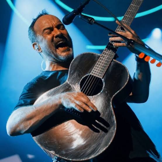 Dave Matthews Band performing on stage during their 2026 summer concert tour at the BankNH Pavilion in New Hampshire.