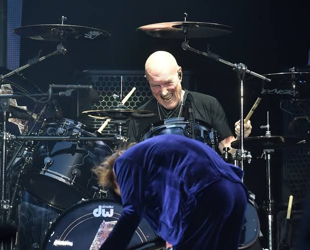 Chris Slade, drummer for AC/DC, performing on stage at the Olympic Stadium in London during a 2016 concert.