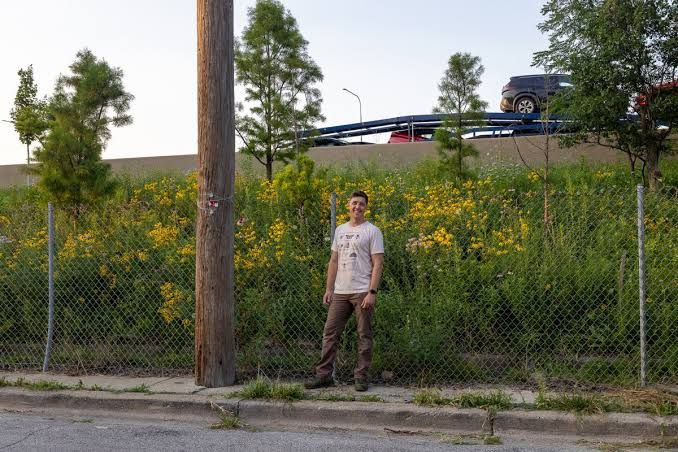 Ian Kibbe stands in his native wildflower garden alongside the Kennedy Expressway in Bucktown.