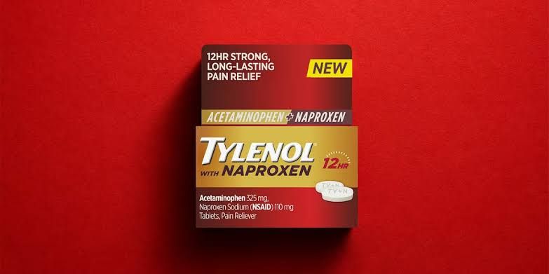 A close-up of a medication box containing an acetaminophen and naproxen sodium combination for pain relief.