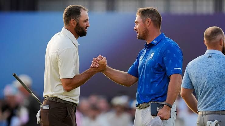 Scottie Scheffler and Bryson DeChambeau shaking hands on the 18th hole at The Open Championship.