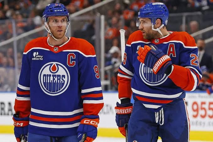 Connor McDavid skates down the ice during an NHL regular season game.