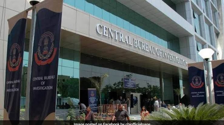 Anil Ambani walks past the Central Bureau of Investigation headquarters in New Delhi during a prior regulatory inquiry.