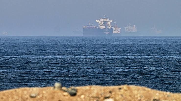 Cargo ships anchored in the Strait of Hormuz off the coast of Khor Fakkan, United Arab Emirates.