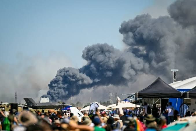 Plumes of black smoke rising from the Tanagra air force base after a Phantom F-4 jet crash.