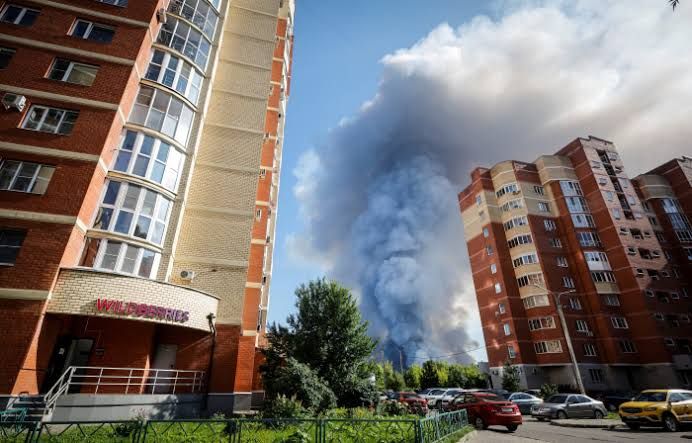 Smoke rises from a damaged warehouse facility in Russia following a long-range drone strike by Ukrainian forces.