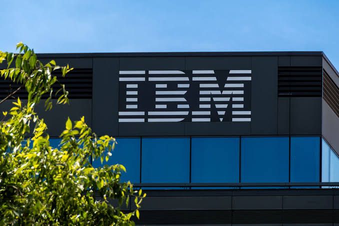 IBM corporate office building entrance during a sunny day in a suburban business park setting.
