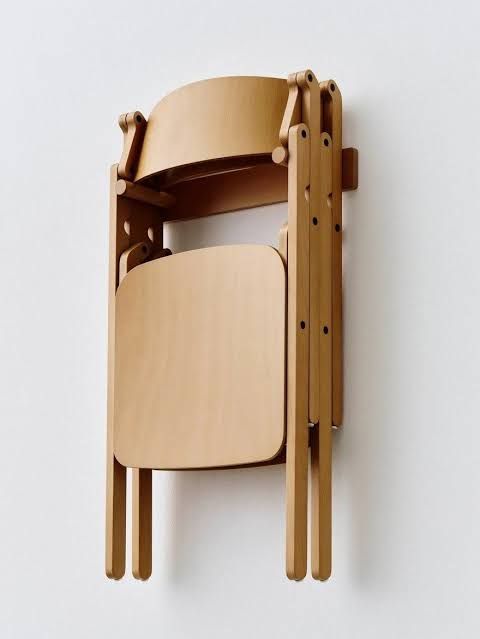 Gudmundur Ludvik's Backflip chair folded and unfolded to show the concealed hinge mechanism.