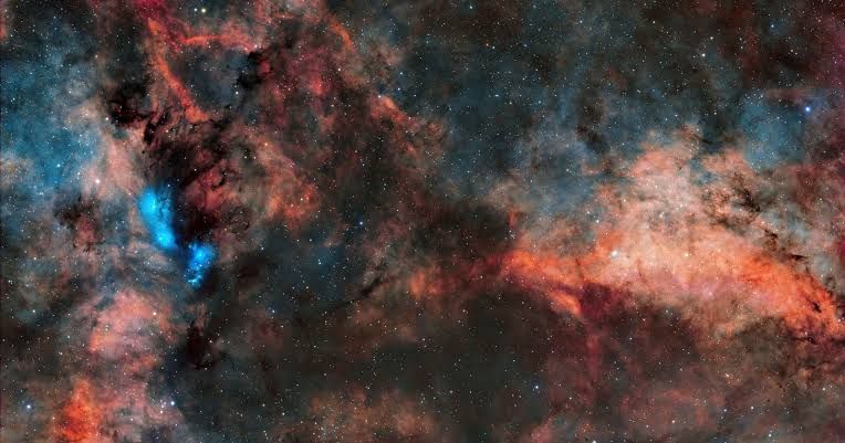 The Kepler space telescope orbiting in space with a vast field of stars in the background.