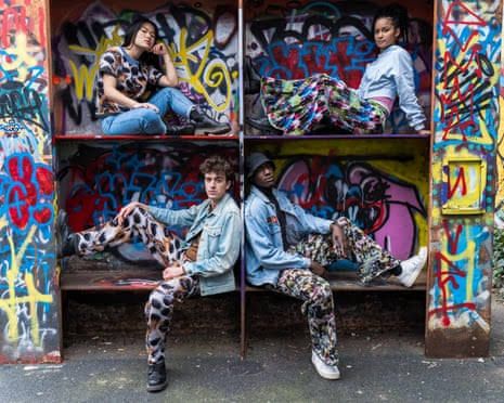 Models wearing patterned garments from Cap_able designed to confuse facial recognition algorithms.