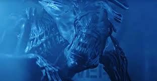 The Alien Queen puppet from the film Aliens shown with her large fanged head and distinct black insect-like features.