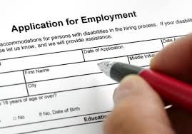 Employment application form resting on a desk, representing the city of Toledo's new youth hiring program.
