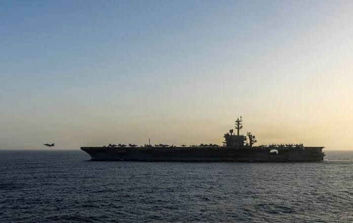 The aircraft carrier USS Abraham Lincoln anchored in the Arabian Sea during ongoing military operations.