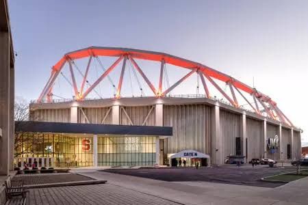 Syracuse men's basketball players on the court at the JMA Wireless Dome during a home game.