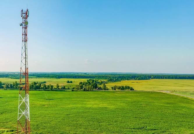 A conceptual view of high-speed internet infrastructure installation in a rural southern Delaware landscape.