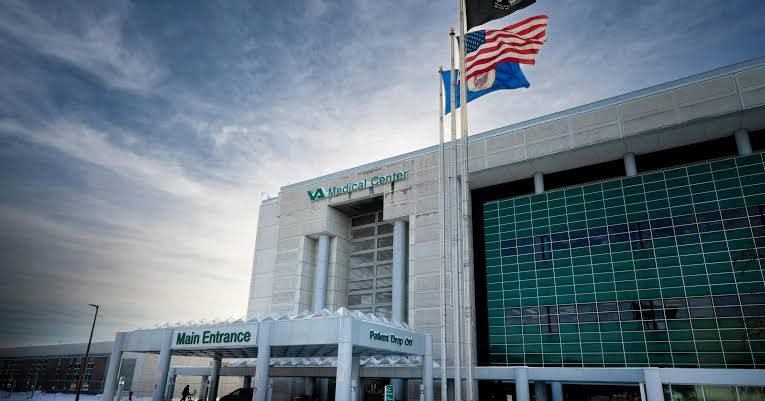 Exterior view of the Minneapolis VA Medical Center building under clear skies.