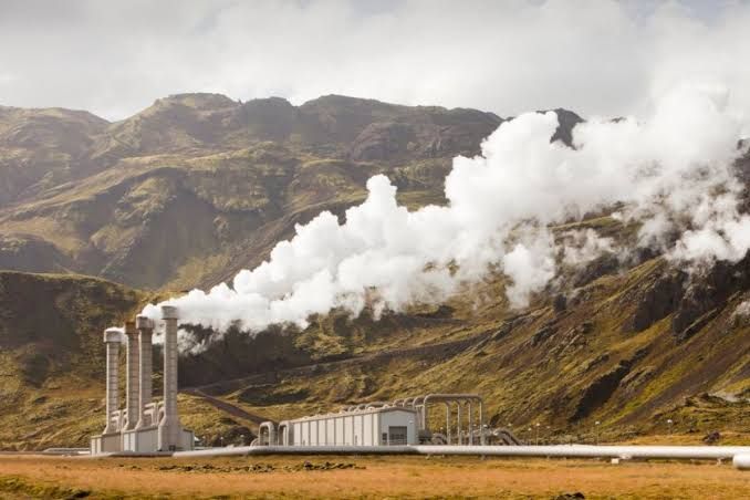 A laser beam cutting through dense rock to demonstrate non-mechanical drilling technology for geothermal extraction.