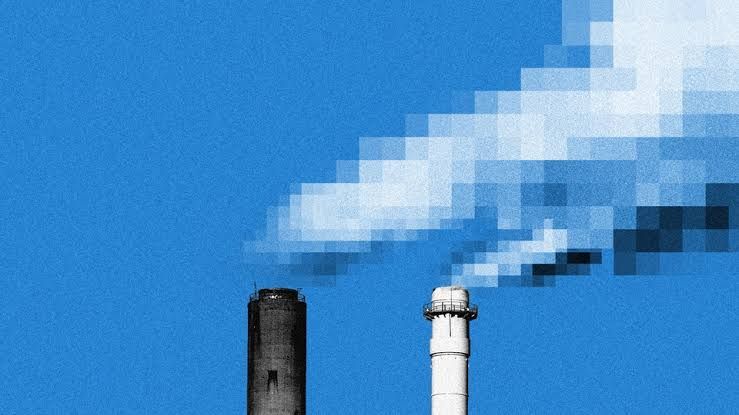 A smoking industrial chimney with a pixelated top representing the intersection of tech and heavy industry.