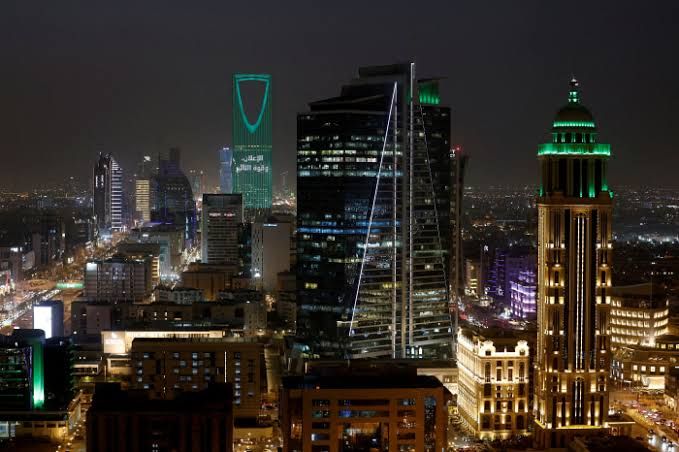 Aerial view of the Riyadh skyline featuring modern skyscrapers and ongoing construction projects in Saudi Arabia.