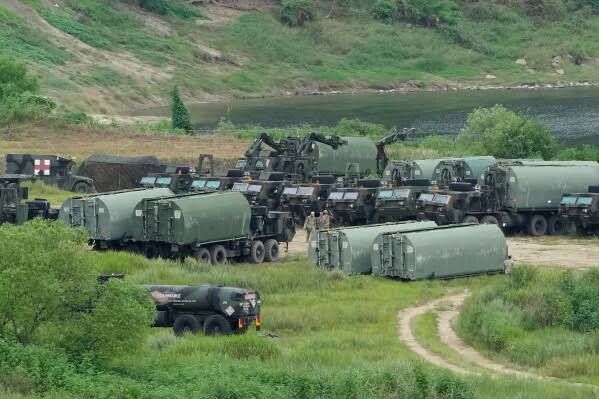 U.S. Army armored vehicles cross a river at a training field in Yeoncheon, South Korea, near the border with North Korea.