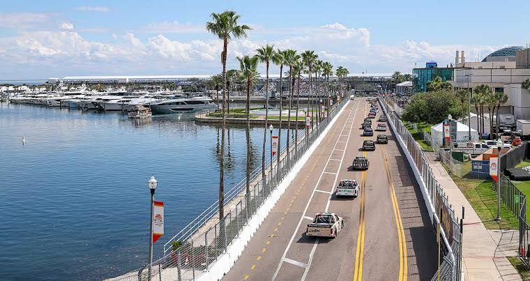 The Craftsman Truck Series field racing along the marina at the St. Petersburg Grand Prix street circuit.