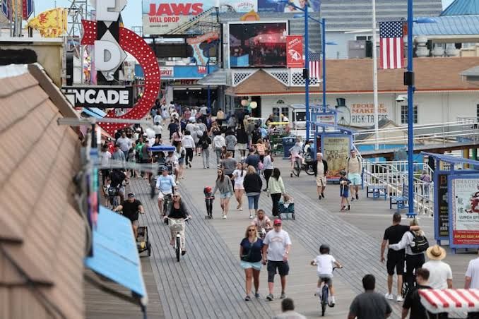 Crowd walking along the boardwalk in Wildwood, New Jersey.