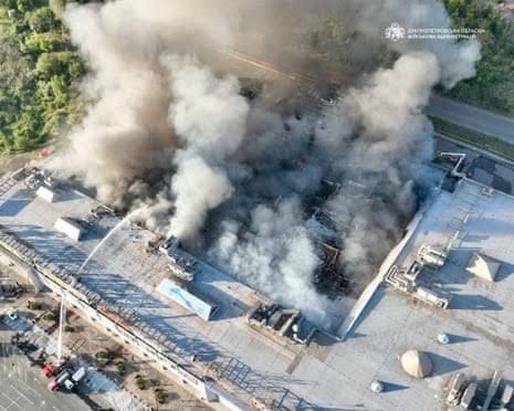 Firefighters search for survivors at the destroyed shopping center in Kryvyi Rih following the Russian drone strike.