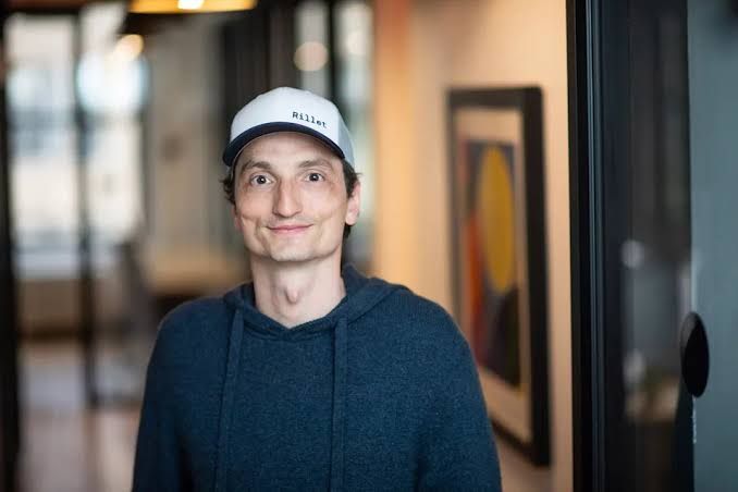 Nicolas Kopp, founder and CEO of Rillet, posing for a professional portrait in a business setting.