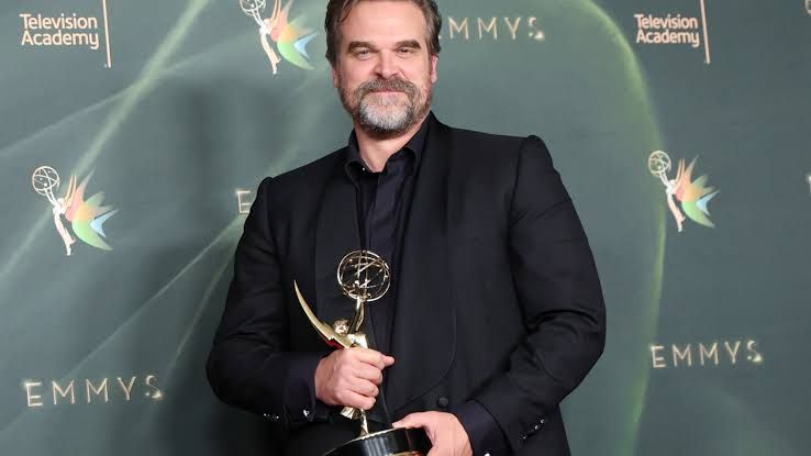 David Harbour holding his first Emmy Award after winning for his performance in DTF St. Louis.