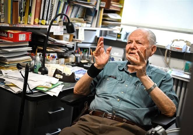 Jim Choyke holding a silicon carbide wafer in his office at the University of Pittsburgh.