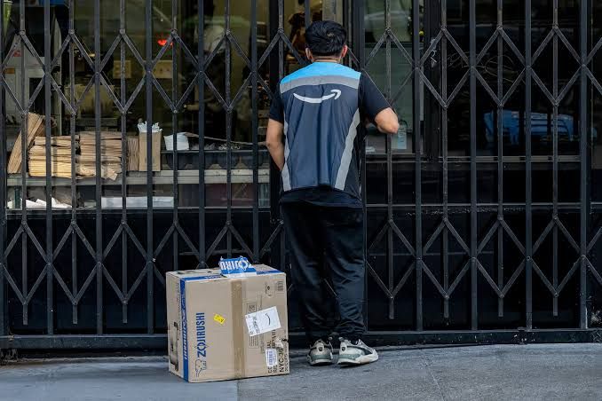 An Amazon delivery driver navigates a city street in San Francisco during a daytime shift.