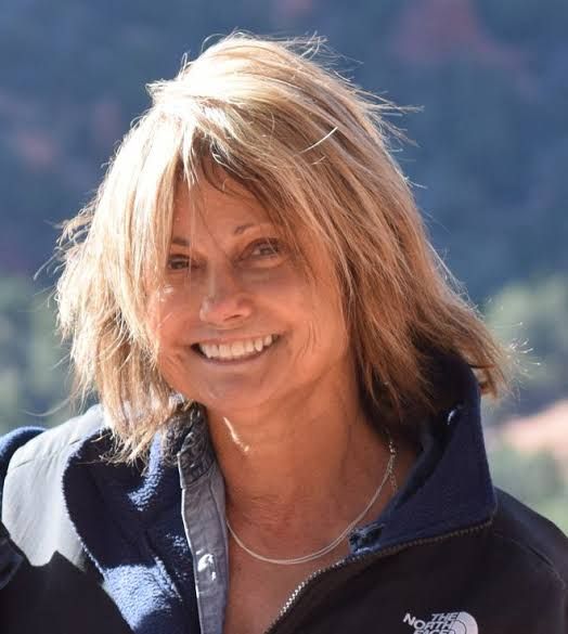 Author Jane Simon Ammeson stands with her new travel book about South Bend.