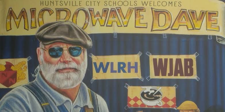A colorful mural of local musician Microwave Dave painted on the side of The Lumberyard building in downtown Huntsville.